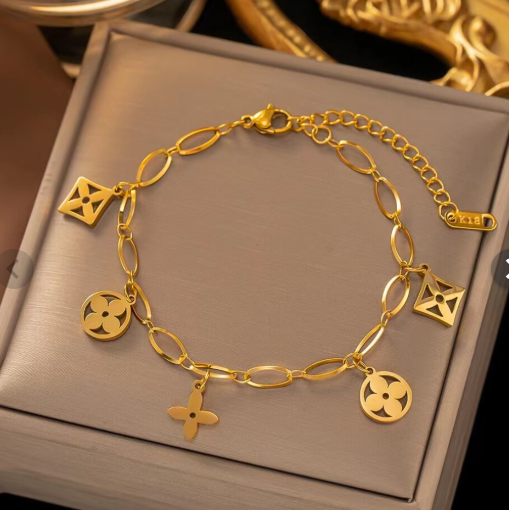 Gold bracelet with charms